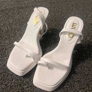 Eco white never worn heels.